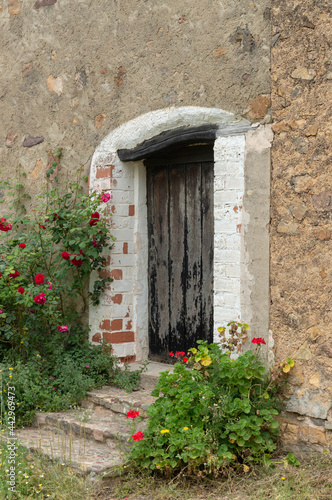 wooden front door to enter a rural home in a mountain village