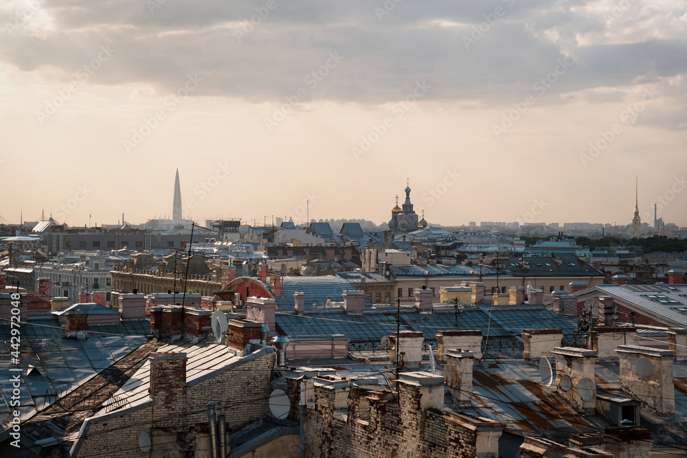 Obraz premium Cityscape view over the rooftops of St. Petersburg. View of the rooftops against the sky