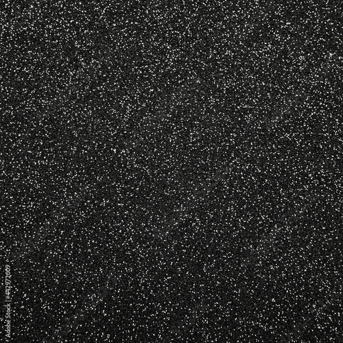 Abstract background texture of black glitter