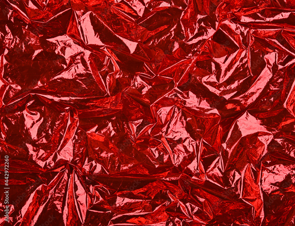 Abstract background of red crumpled plastic