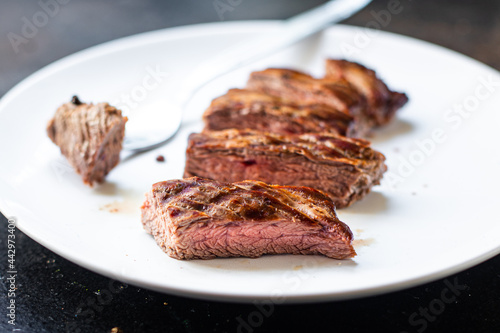 fresh steak beef juicy grilled meat barbecue portion B-B-Q on the table, healthy food meal snack copy space food background rustic. top view keto or paleo diet