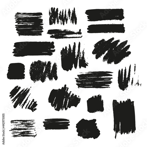 Black vector brush strokes of paint on white background. Paint spots