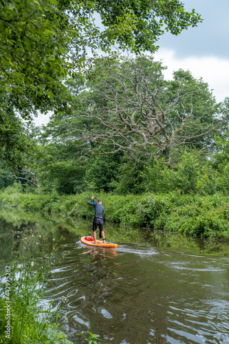 Paddle boarding on the river Wey, Godalming Canal photo