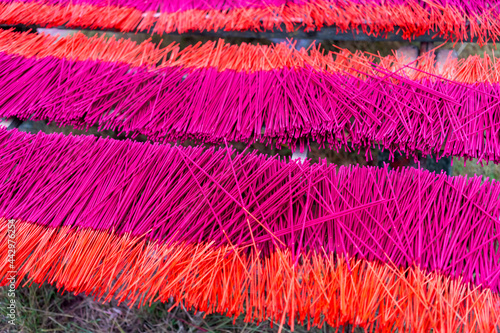 China Fujian Province Dapu Yongchun. Incense sticks are spread on racks to dry at the incense factory. photo