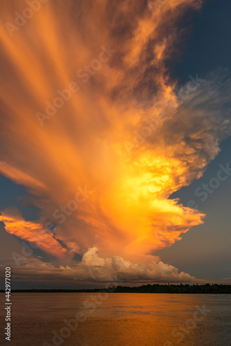 Indonesia West Papua Raja Ampat. Brilliant clouds lit at sunset.