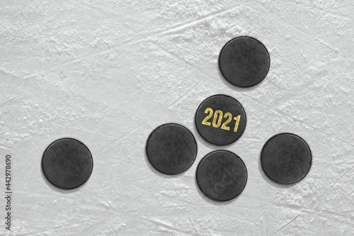 Hockey pucks on the ice rink