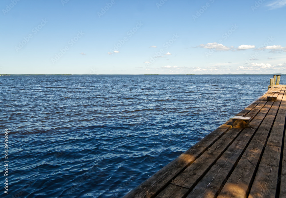 ship docking pier in big lake in Finland