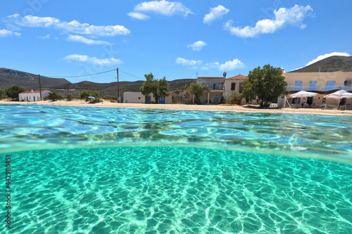 Sea level and underwater split photo of paradise sandy beach of Diakofti with turquoise crystal clear sea in island of Kythira, GReece