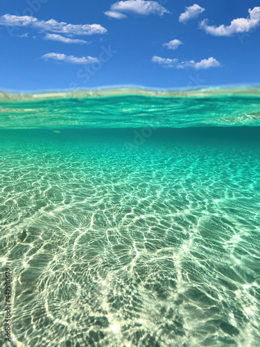 Fototapeta Naklejka Na Ścianę i Meble -  Split underwater photo of exotic island paradise bay with crystal clear emerald sandy beach