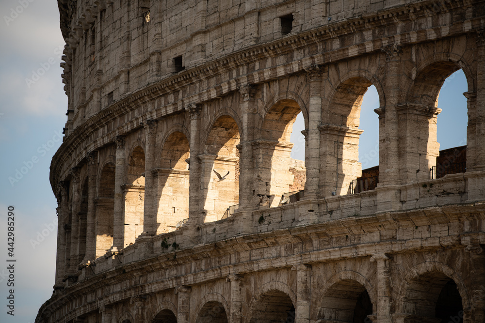 Sunny day in Rome. Colosseum. Aqueduct in Italian architecture
