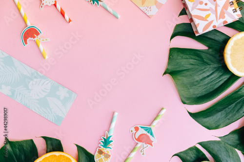 Flat Lay Summer tropical background. Workspace with supplies and fresh fruits. Top view, copy space