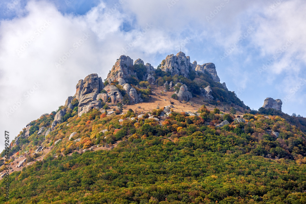 Fototapeta premium Beautiful scenic sunny landscape of Yuzhnaya Demerdzhi rocky mountain in Crimea called Dolina Privideniy, or Ghost Valley.