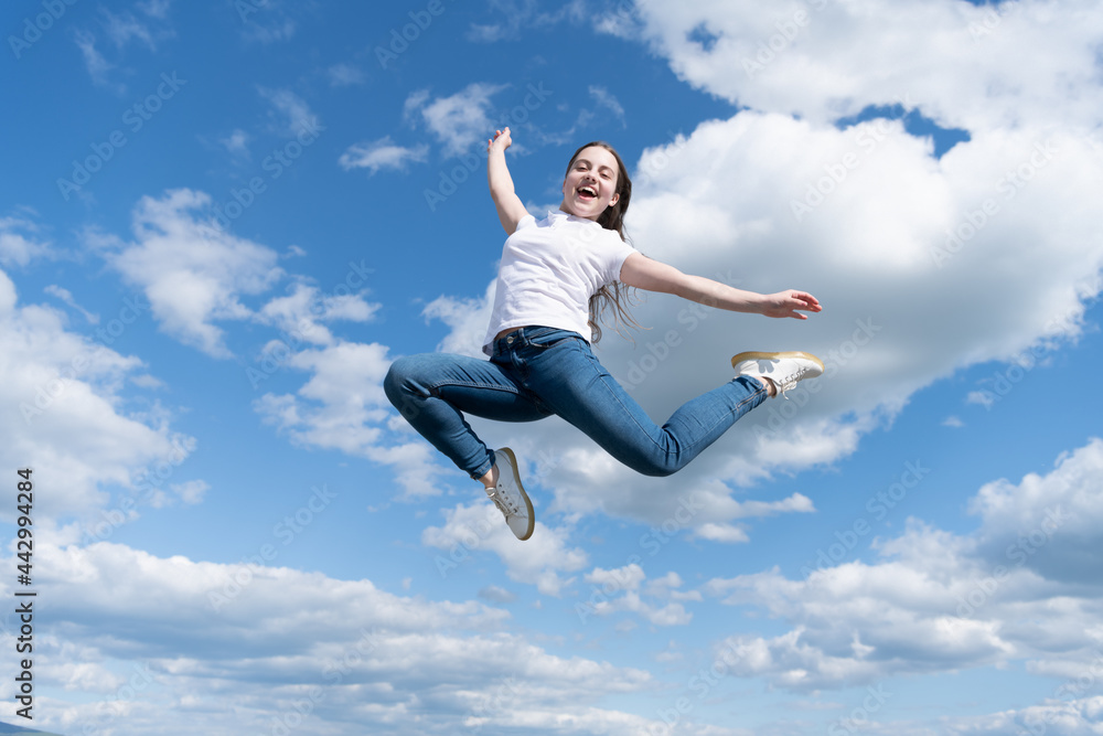 Young and free. future of sport. outdoor activity. healthy child jumping outdoor. kid full of energy Young and free. future of sport. outdoor activity. healthy child jumping outdoor. kid full of energy