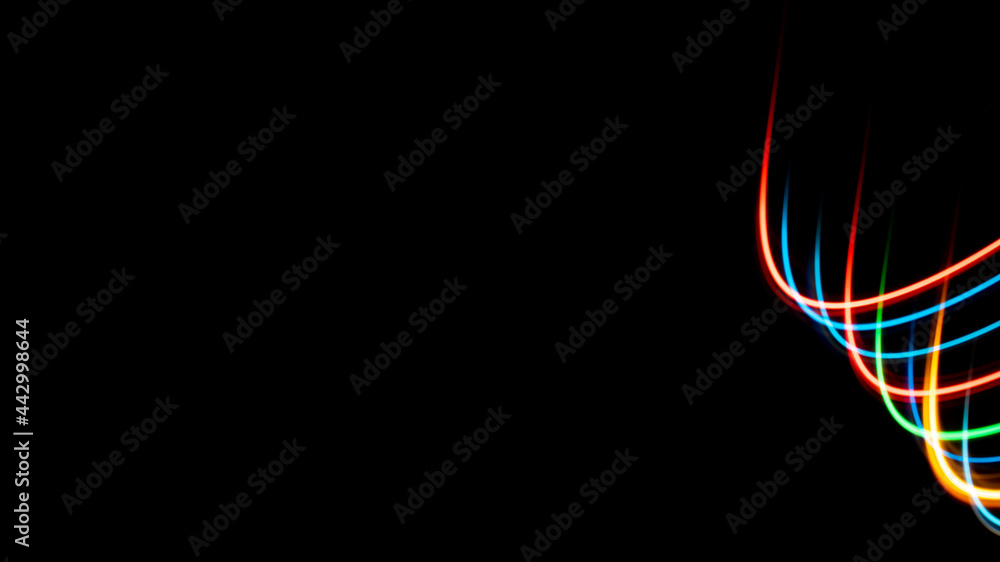 Luminous multicolored wavy lines on a black background Luminous multicolored wavy lines on a black background