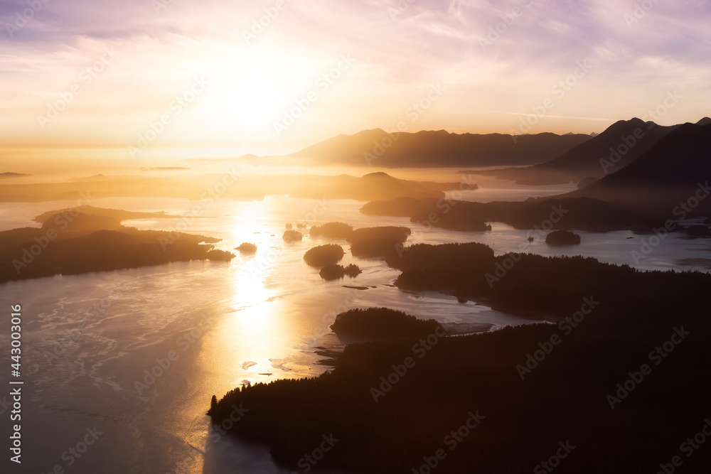 Aerial Canadian Landscape at the West Pacific Ocean Coast. Bright colorful vibrant sunset Art Render. Taken from Airplane in Tofino, Vancouver Island, British Columbia, Canada.