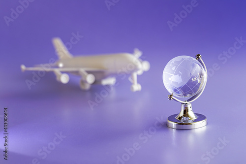 Glass globe and airplane model, travel and Globalization concept