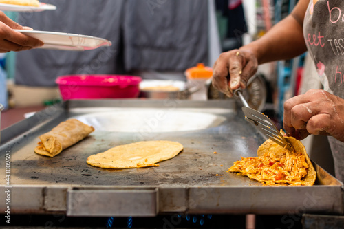 woman's hand preparing a typical mexican food as a quesadillas, sopes, huaraches and more