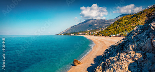 Panoramic spring view of publik beach in Dhermi town. Colorful morning seascape of Adriatic sea. Attractive spring scene of Albania, Europe. Traveling concept background.