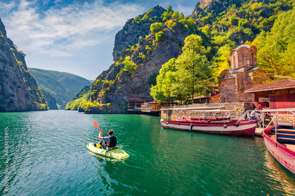 Tourist kayaking on the Matka Canyon. Picturesque morning scene of North Macedonia, Europe. Traveling concept background.
