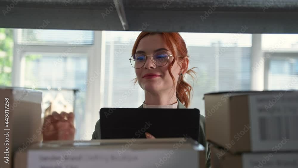 work of an online store, a young woman entrepreneur with a tablet in her hands is checking orders of buyers of an Internet shop, close-up work of an online store, a young woman entrepreneur with a tablet in her hands is checking orders of buyers of an Internet shop, close-up