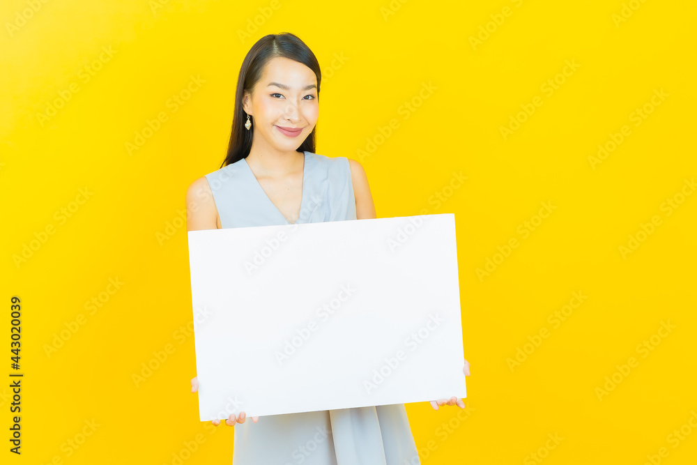 Portrait beautiful young asian woman with empty white billboard Portrait beautiful young asian woman with empty white billboard