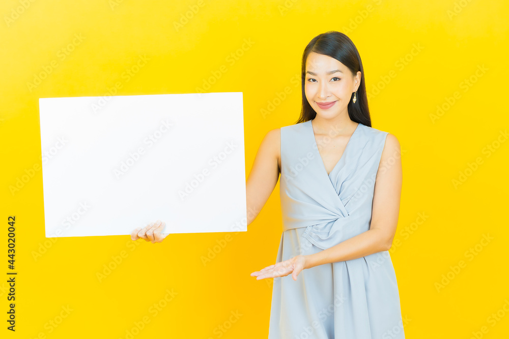 Portrait beautiful young asian woman with empty white billboard Portrait beautiful young asian woman with empty white billboard
