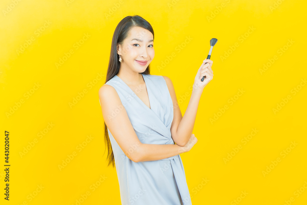 Portrait beautiful young asian woman with make up brush cosmetic Portrait beautiful young asian woman with make up brush cosmetic