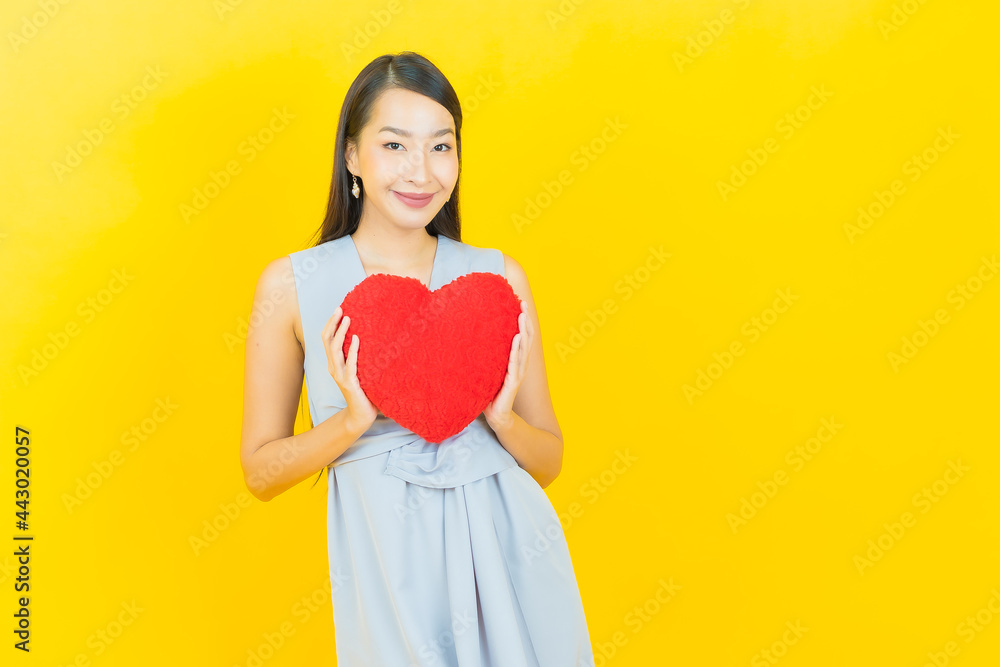 Portrait beautiful young asian woman smile with heart pillow shape Portrait beautiful young asian woman smile with heart pillow shape