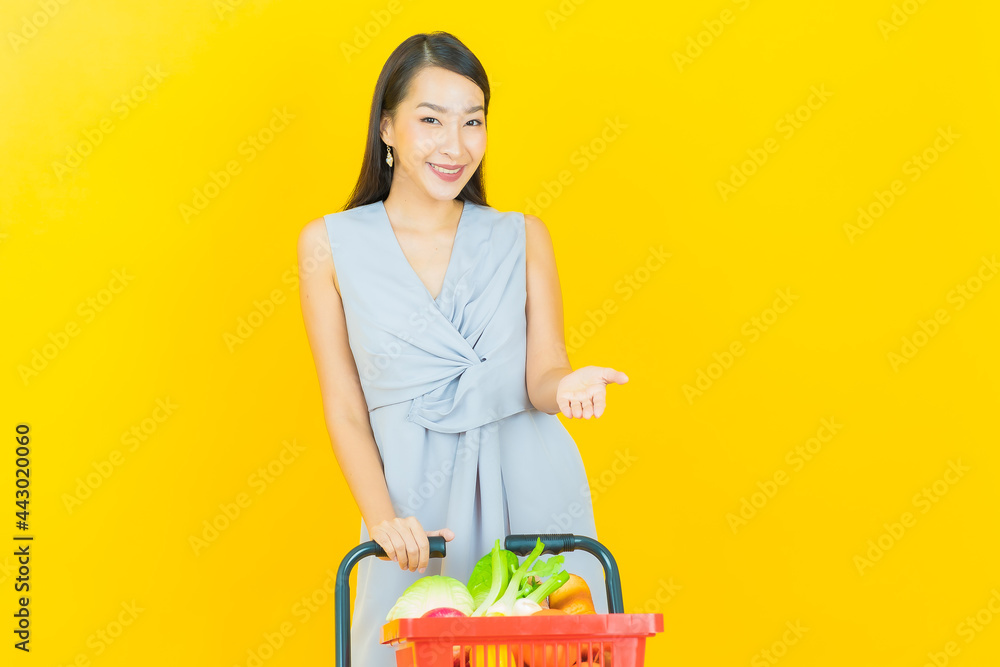 Portrait beautiful young asian woman smile with grocery basket Portrait beautiful young asian woman smile with grocery basket