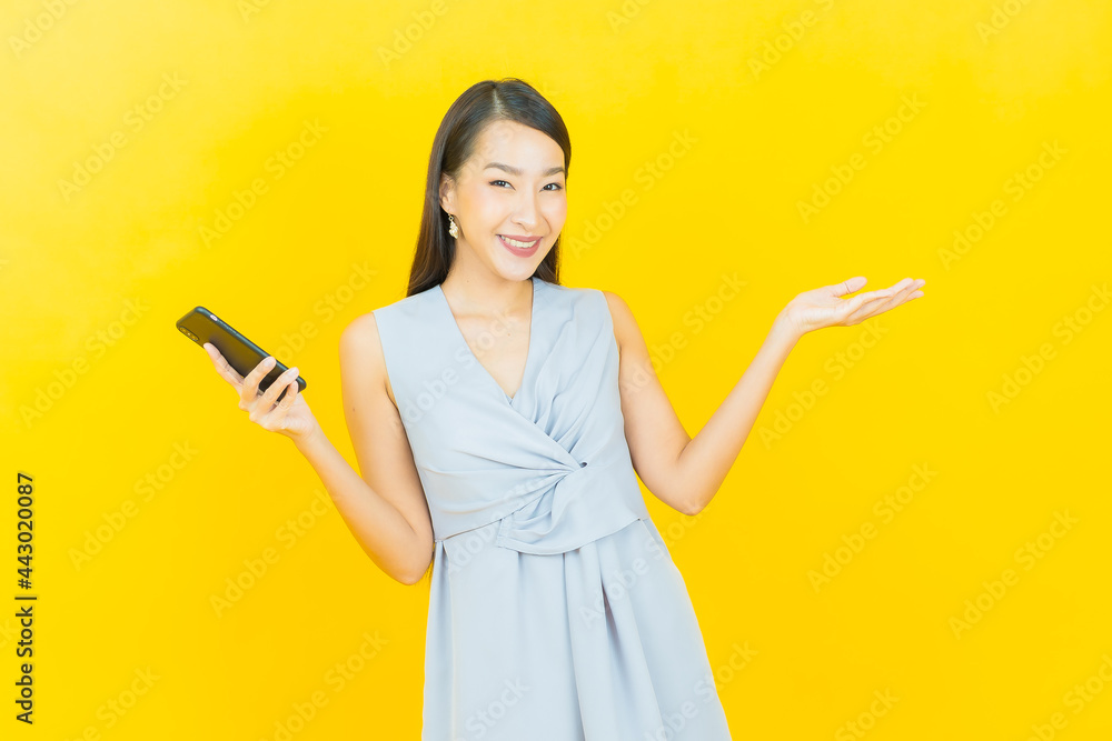 Portrait beautiful young asian woman smile with smart mobile phone Portrait beautiful young asian woman smile with smart mobile phone