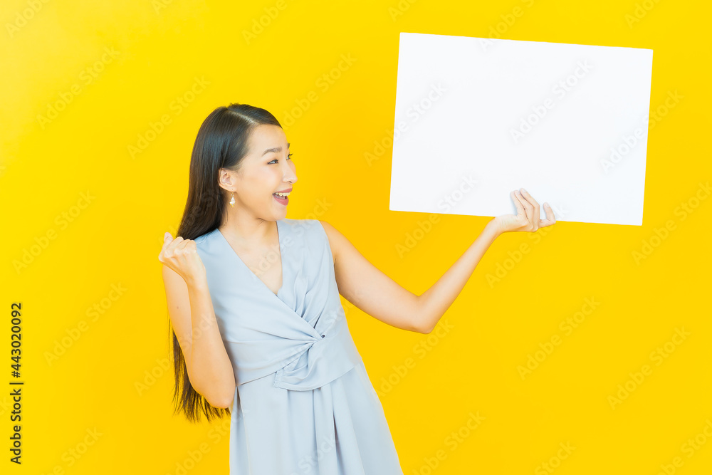 Portrait beautiful young asian woman with empty white billboard Portrait beautiful young asian woman with empty white billboard