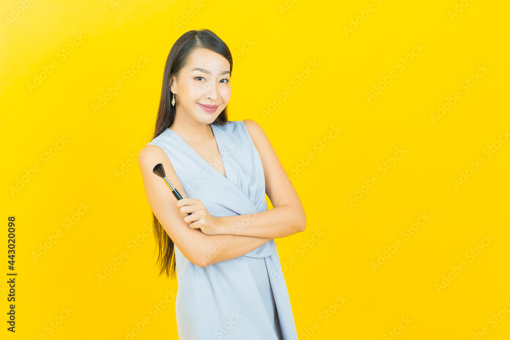 Portrait beautiful young asian woman with make up brush cosmetic Portrait beautiful young asian woman with make up brush cosmetic