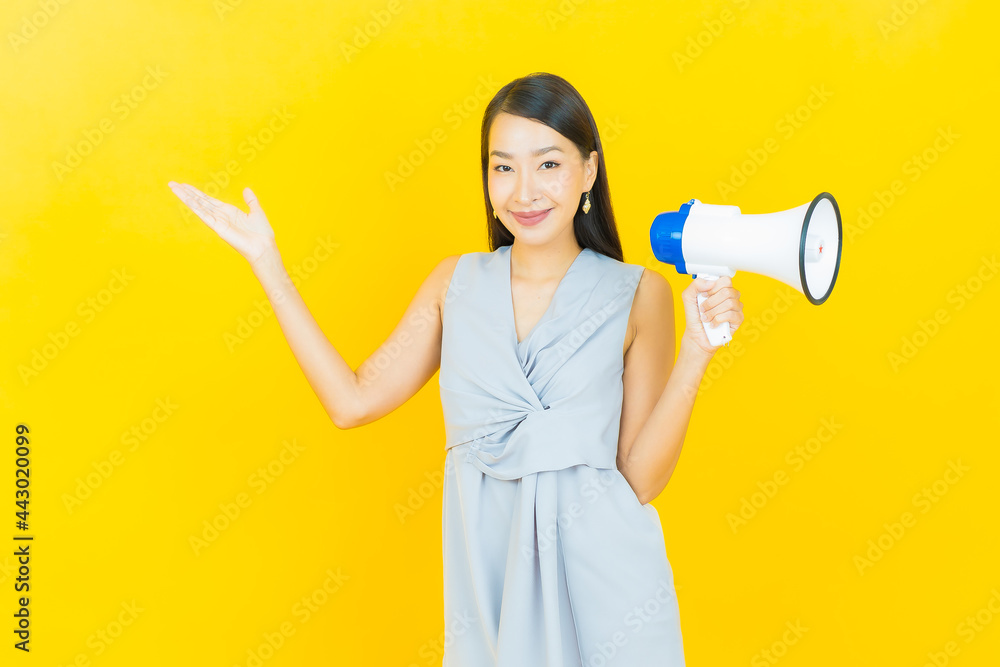 Portrait beautiful young asian woman smile with megaphone Portrait beautiful young asian woman smile with megaphone