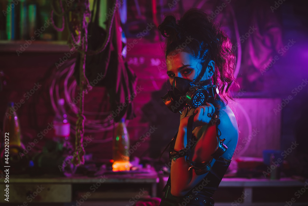 Cyberpunk cosplay. A girl in a gas mask in a post-apocalyptic style with neon lighting
