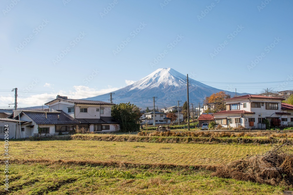 Yamanashi, Japan - The Fuji Mountain's view with blue clear sky take from Shimoyoshida station. This is shown the contry side living and rural culture style of Japanese with 