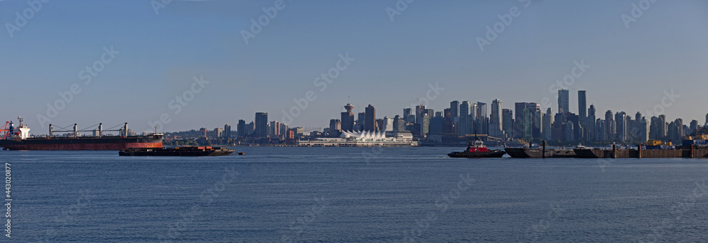 The view from Waterfront Park in North Vancouver, looking at the Vancouver Canada Place Sails across the Burrard Inlet