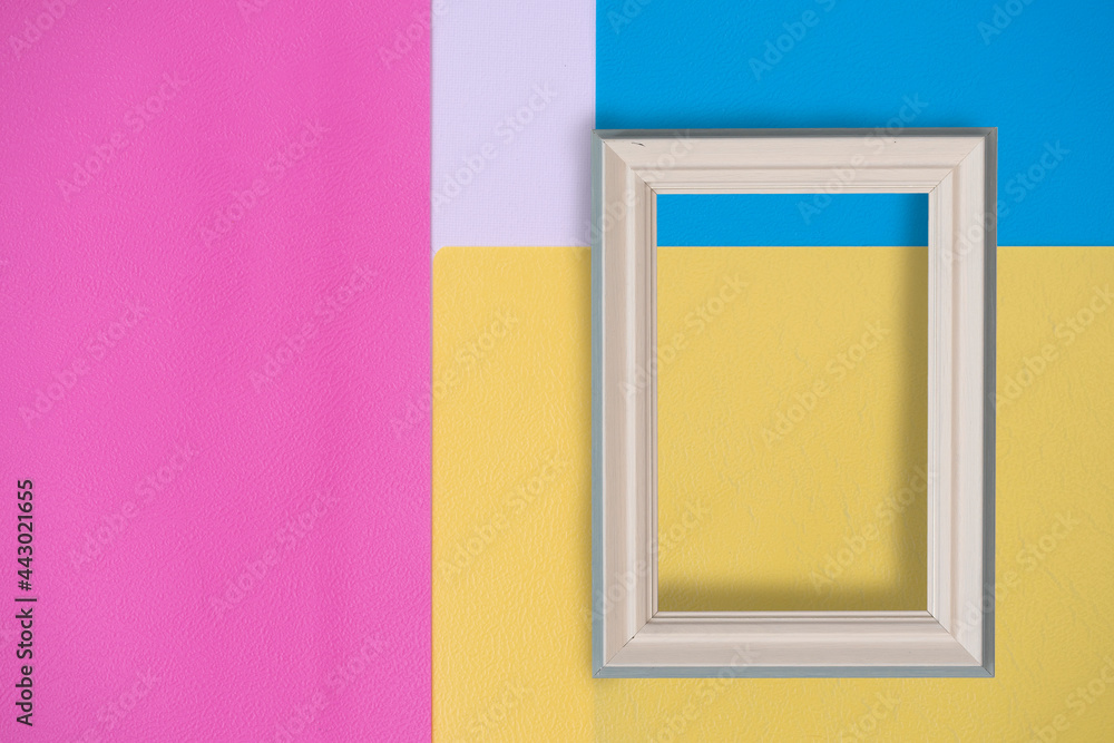Abstract white background for design with pink, blue and yellow paper and frame. View from above. Abstract white background for design with pink, blue and yellow paper and frame. View from above.
