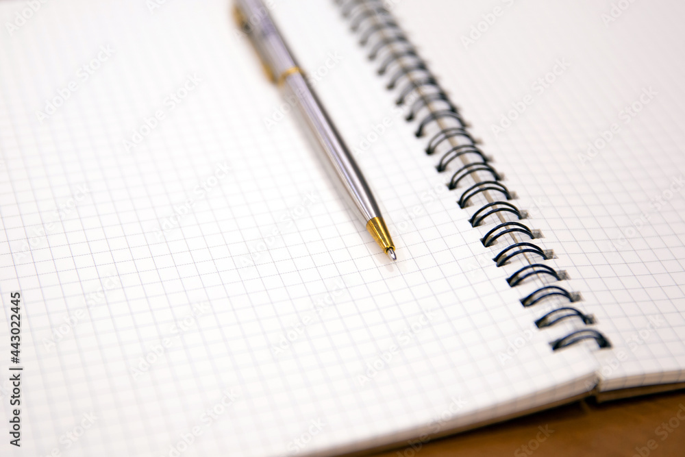 Close-up notebook or note book diary with a pen or pencil on top view desk or boardroom table for meeting notes. Close-up notebook or note book diary with a pen or pencil on top view desk or boardroom table for meeting notes.