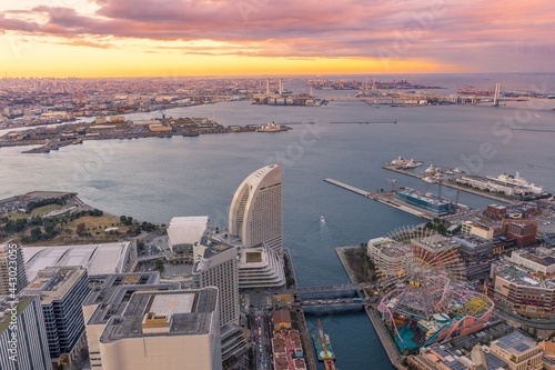 Yokohama, Japan - YOKOHAMA city MINATOMIRAI, Panorama twilight cityscape and colorful golden light skyline of Yokohama from the Yokohama bay during sunset from the observation tower of Landmark Tower.