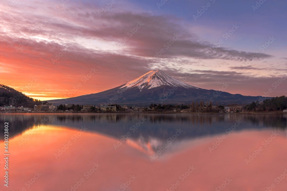Landscape photo of Mount Fuji and its reflection on the water during the sunrise taken from Lake Kawaguchiko, Yamanashi Tokyo Japan