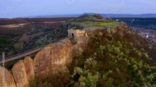 Adorable sunset on Ovech Fortress. Colorful spring cityscape of Provadia town, Bulgaria, Europe. 4k drone flight point of view (Ultra High Definition). photo