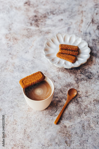 Karak Tea, a masala chai tea originally from South Asia but now a tradition in Qatar but drunk all over the Gulf region of the Middle East. Served here with a Lotus Biscoff biscuit. photo