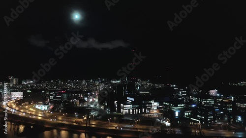 Wallpaper Mural Helsinki.Finland-November 23. 2020: Drone point of view of a smoking chimney in Helsinki on a moonlit night. Aerial shot with the camera being stationary. Torontodigital.ca