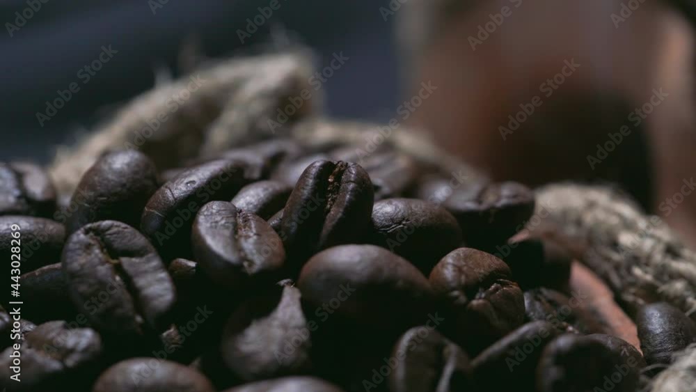 Roasted coffee beans in a cloth bag. Smoke from coffee roasting. Roasted coffee beans in a cloth bag. Smoke from coffee roasting.