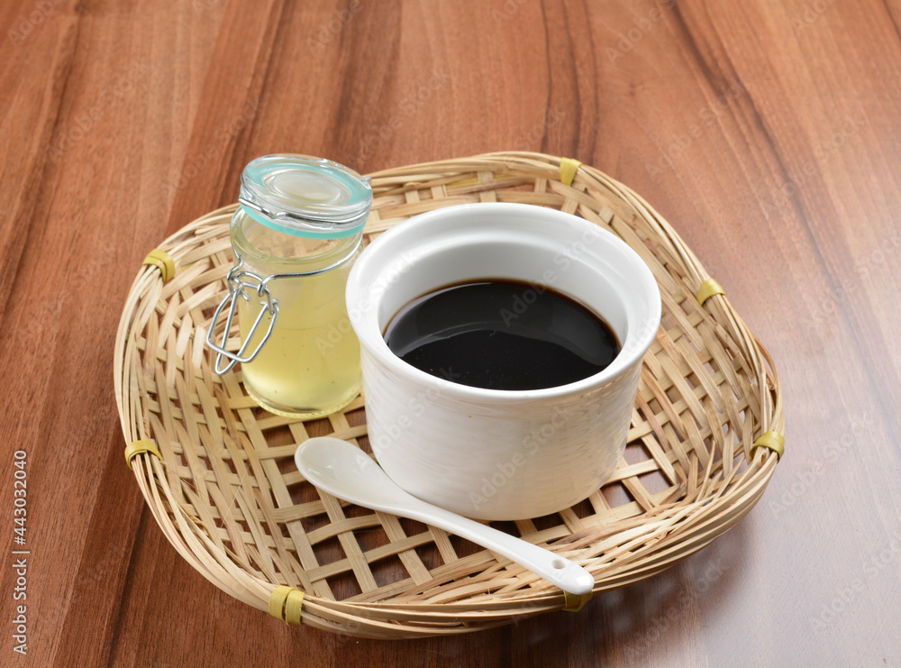 chilled black herbal jelly pudding (Gui ling gao) with fresh honey