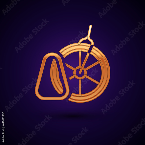 Gold Bicycle parking icon isolated on black background. Vector