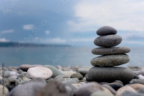 stack of zen stones on pebble beach
