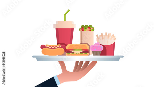 human hand holding plate with burger hot dog cola and cupcake junk unhealthy fast food concept horizontal