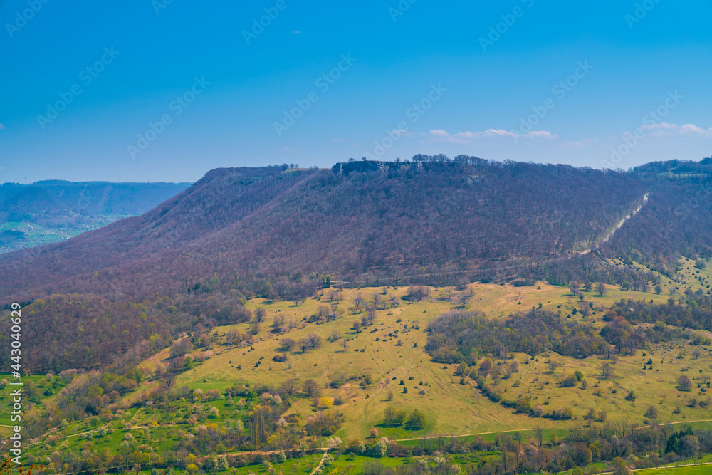 Obraz premium Germany, Panorama aerial drone view to breitenstein rock in swabian alb nature landscape near stuttgart on sunny day