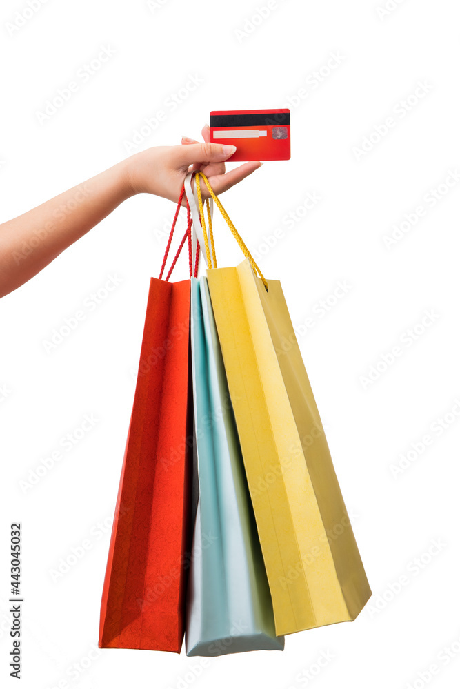 Shopping bags and credit card in hand.